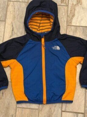 The North Face kids size 12 months (Unisex) blue/orange Reversible fleece jacket